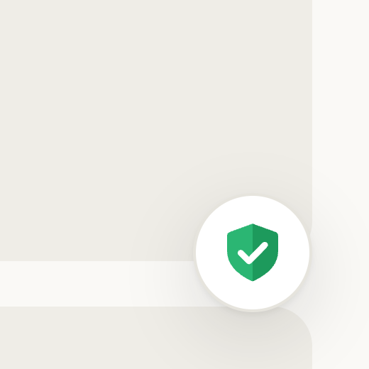 On a phone, before a tap: a round button with a green shield and a status dot in the bottom-right corner.